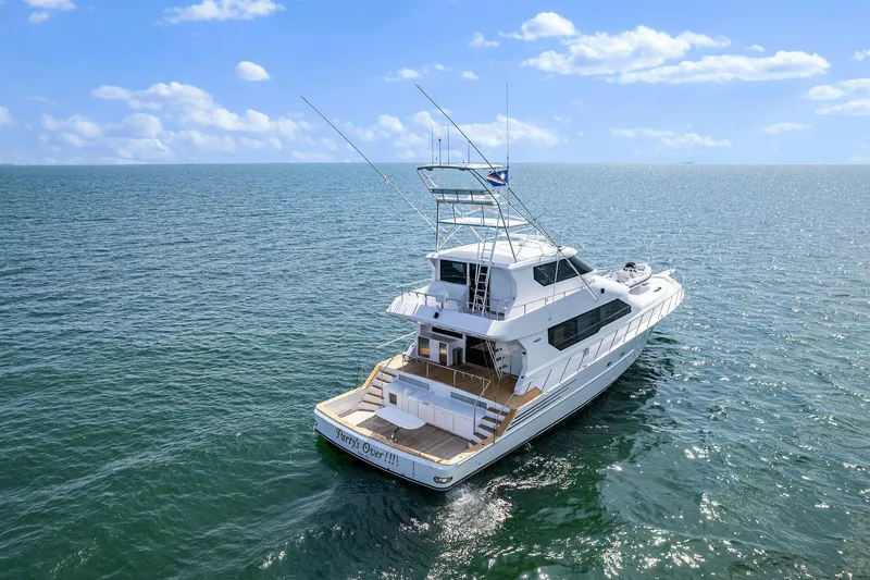 Party's Over Yacht Photos Pics 2006 Northstar Enclosed Flybridge yacht cruising on open water under a clear sky.