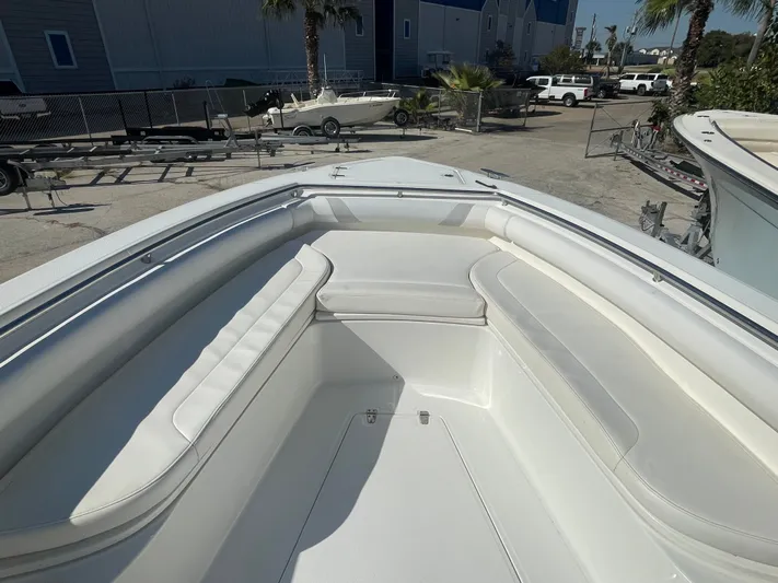  Yacht Photos Pics 2013 Boston Whaler 320 Outrage boat interior with white seating and spacious deck.