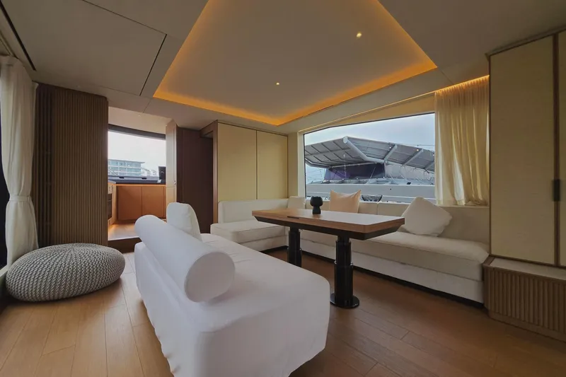  Yacht Photos Pics Luxurious interior of 2025 Azimut Seadeck 7 yacht with modern furnishings and large window view.