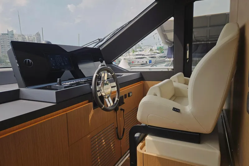 Yacht Photos Pics 2025 Azimut Seadeck 7 yacht helm with modern controls and luxurious seating.