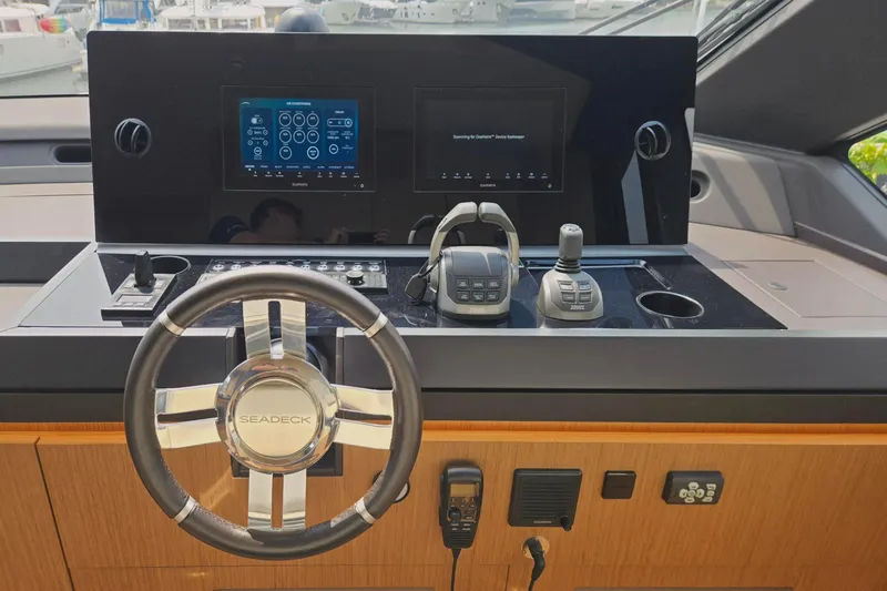  Yacht Photos Pics 2025 Azimut Seadeck 7 yacht helm with advanced navigation controls and sleek design.