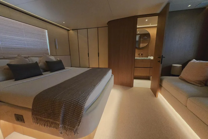  Yacht Photos Pics Luxurious bedroom interior of 2025 Azimut Seadeck 7 yacht with modern design.