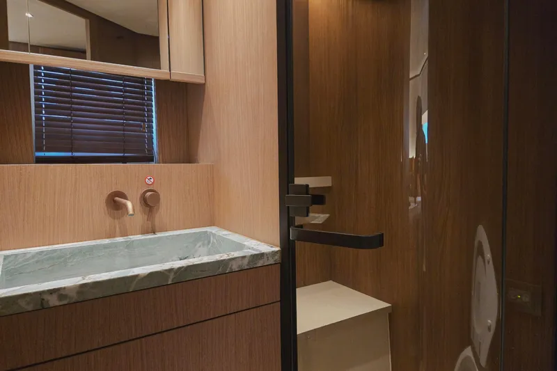  Yacht Photos Pics Luxurious bathroom interior of 2025 Azimut Seadeck 7 yacht with modern fixtures.