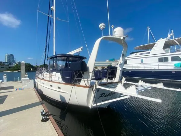 Patience Yacht Photos Pics Sailboat docked at marina, Irwin 54 model, 1989, under clear blue sky.