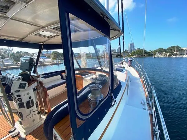 Patience Yacht Photos Pics 1989 Irwin 54 yacht deck with helm, seating, and marina view.