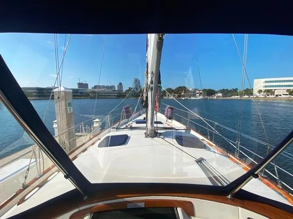 Patience Yacht Photos Pics 1989 Irwin 54 sailboat docked, city skyline in background, viewed from cockpit.