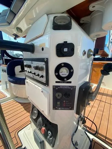 Patience Yacht Photos Pics Control panel of a 1989 Irwin 54 yacht with navigation instruments and teak flooring.