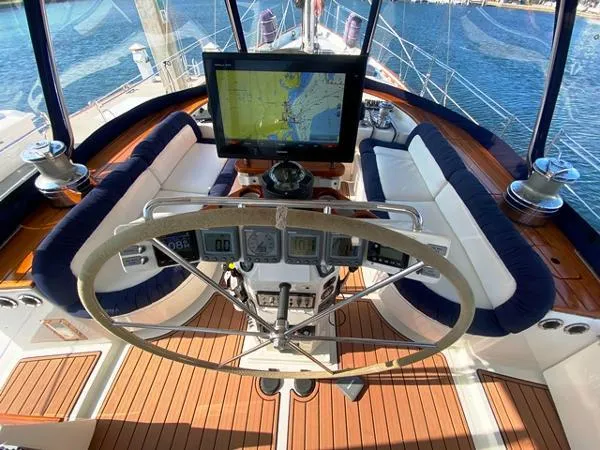 Patience Yacht Photos Pics Cockpit of 1989 Irwin 54 yacht with navigation equipment and seating.