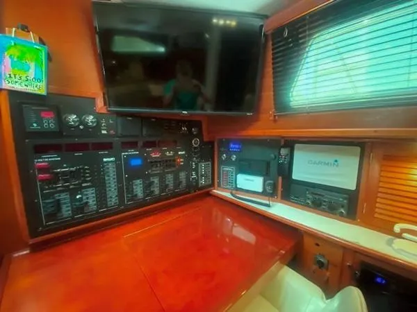 Patience Yacht Photos Pics Navigation station of a 1989 Irwin 54 yacht with control panels and Garmin equipment.