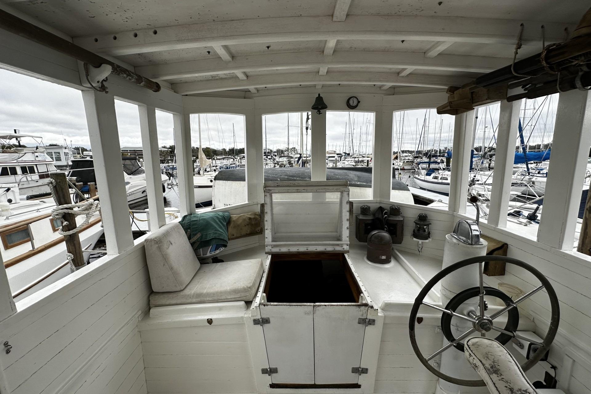 Interior of a 2005 Custom Sail-Assisted Trawler in a marina setting.