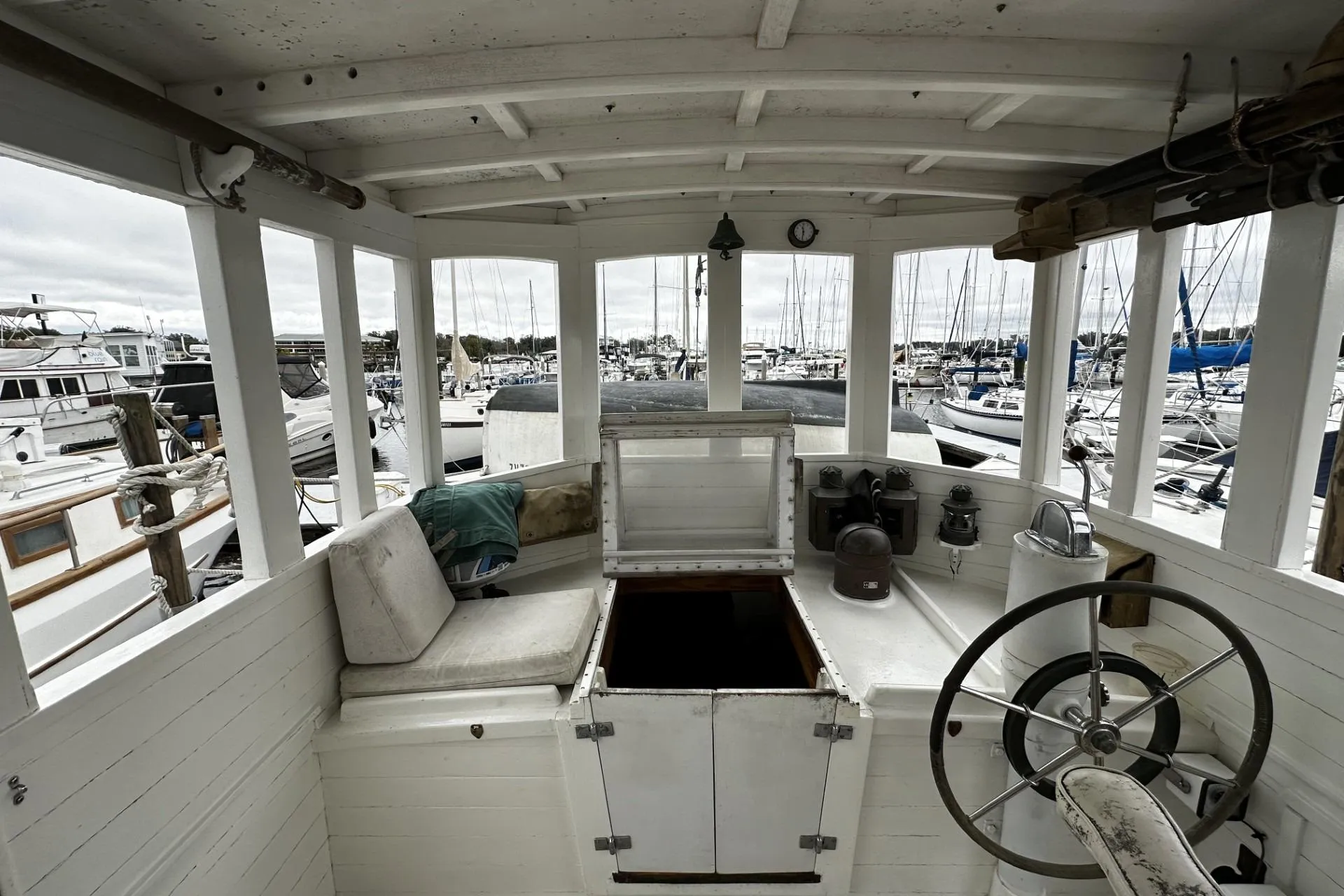 Interior of a 2005 Custom Sail-Assisted Trawler in a marina setting.