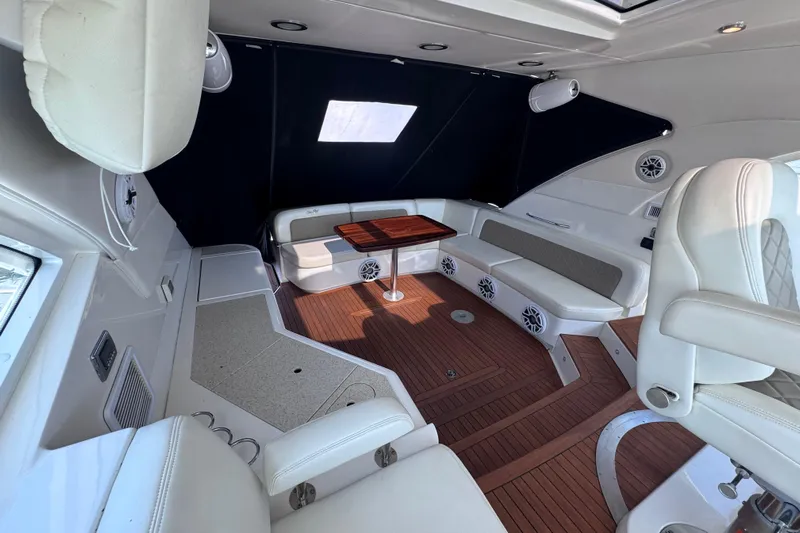  Yacht Photos Pics Luxurious interior of 2011 Sea Ray 540 Sundancer yacht with elegant seating and wood flooring.