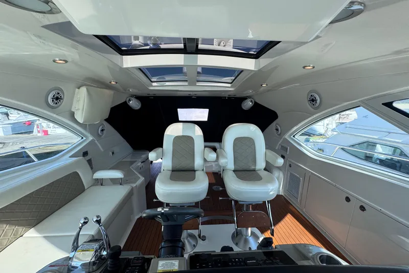  Yacht Photos Pics Luxurious interior of 2011 Sea Ray 540 Sundancer yacht with plush seating and modern controls.