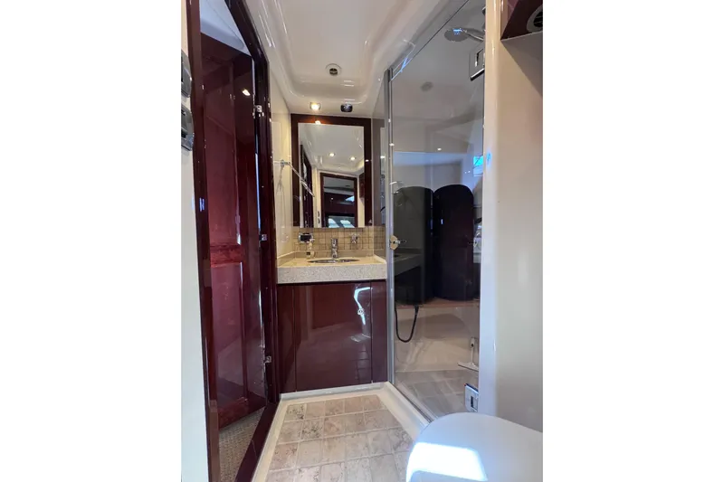  Yacht Photos Pics Luxurious bathroom in 2011 Sea Ray 540 Sundancer yacht with modern fixtures and glass shower.