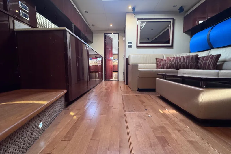  Yacht Photos Pics Luxurious interior of 2011 Sea Ray 540 Sundancer yacht with elegant wood flooring and modern furnishings.