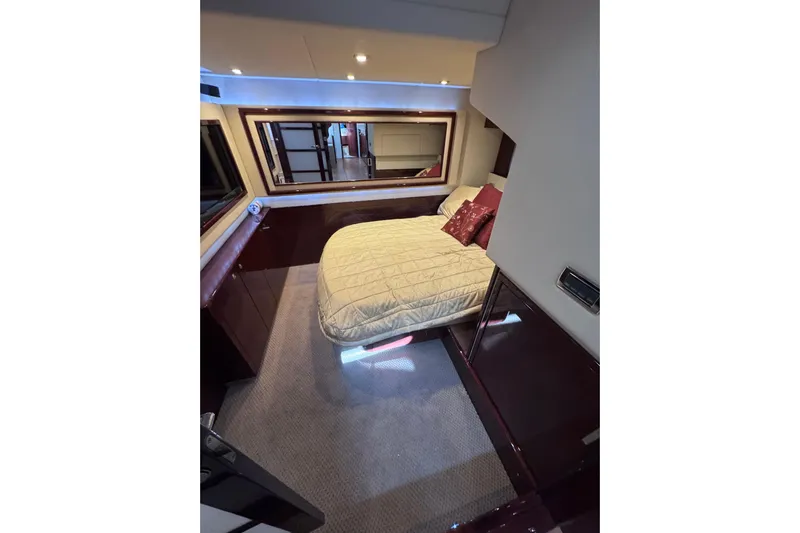  Yacht Photos Pics Luxurious bedroom interior of 2011 Sea Ray 540 Sundancer yacht with elegant bedding.