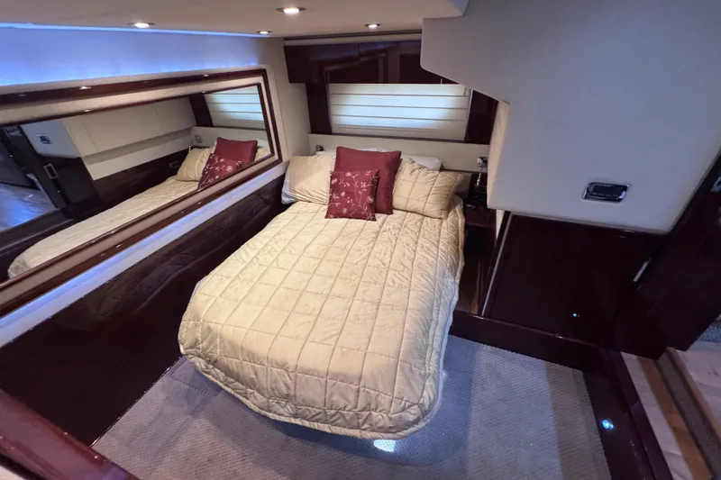  Yacht Photos Pics Luxurious bedroom interior of 2011 Sea Ray 540 Sundancer yacht with elegant bedding.