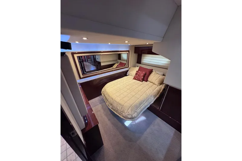  Yacht Photos Pics Luxurious bedroom interior of 2011 Sea Ray 540 Sundancer yacht with elegant bedding.