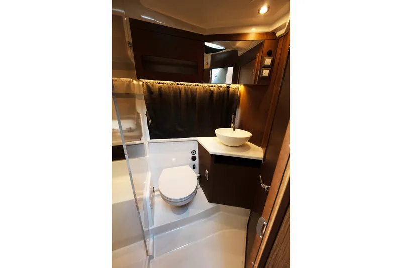 Slack Tide Yacht Photos Pics 2022 Beneteau Antares 11 Coupe bathroom with modern fixtures and elegant design.