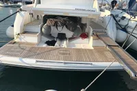 2018 Fairline Targa 48 Open yacht docked, featuring spacious deck and modern design.