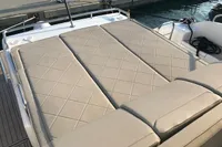 Luxurious sunbed on 2018 Fairline Targa 48 Open yacht, docked at marina.