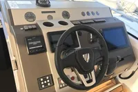 Cockpit of 2018 Fairline Targa 48 Open yacht with steering wheel and navigation controls.