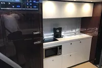 Modern kitchen interior of 2018 Fairline Targa 48 Open yacht with sleek appliances.