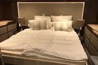 Luxurious bedroom interior of 2018 Fairline Targa 48 Open yacht with elegant bedding.