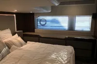 Luxurious bedroom interior of 2018 Fairline Targa 48 Open yacht with modern design.