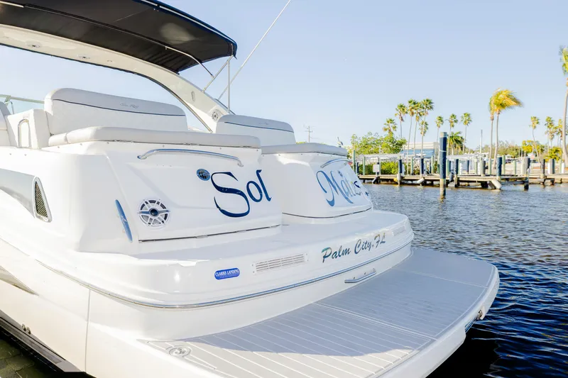 Sol Mates Yacht Photos Pics 2013 Sea Ray 370 Venture yacht docked in Palm City, Florida, with palm trees in background.
