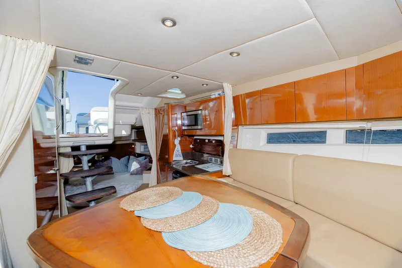 Sol Mates Yacht Photos Pics Interior of 2013 Sea Ray 370 Venture yacht with dining area and modern amenities.