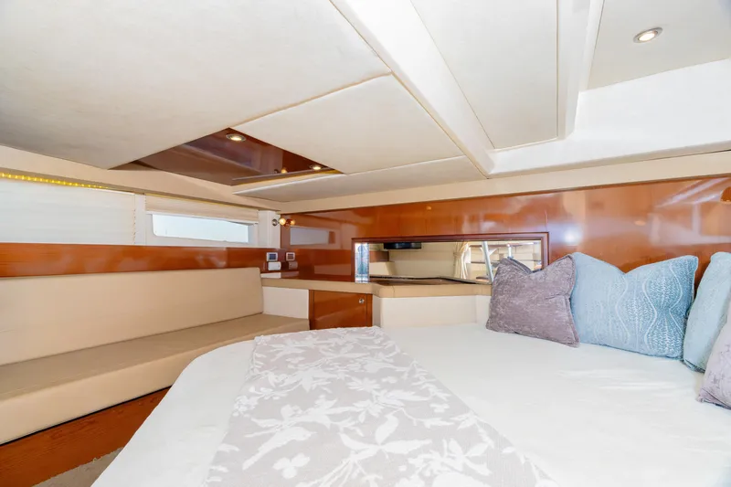 Sol Mates Yacht Photos Pics Luxurious interior of 2013 Sea Ray 370 Venture yacht with elegant seating and bedding.