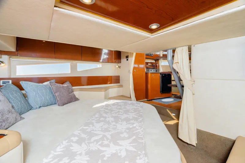 Sol Mates Yacht Photos Pics Luxurious interior of 2013 Sea Ray 370 Venture yacht with cozy bedroom and modern amenities.