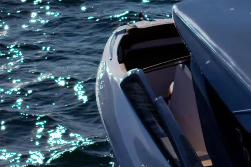  Yacht Photos Pics 2024 NX 280 Xtreme boat on shimmering water surface.