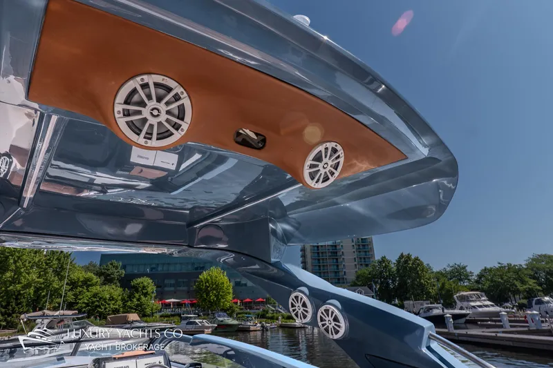  Yacht Photos Pics 2024 NX 280 Xtreme yacht with sleek design and modern audio system at marina.