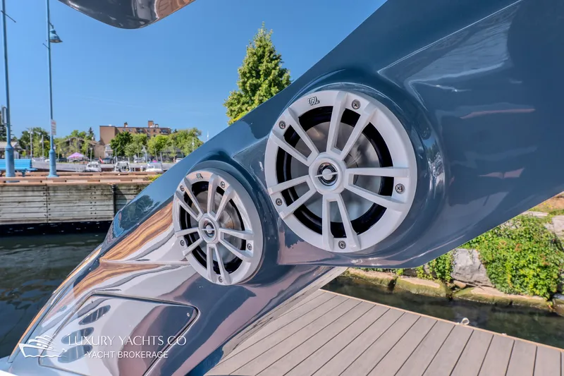  Yacht Photos Pics Close-up of 2024 NX 280 Xtreme boat speakers at a marina dock.