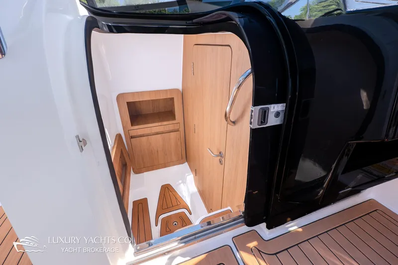  Yacht Photos Pics 2024 NX 280 Xtreme yacht interior with wooden cabinetry and sleek design.