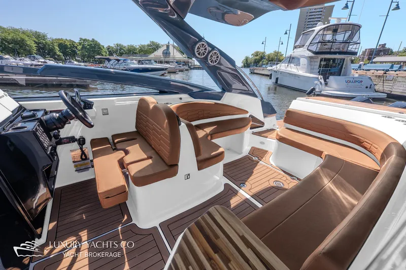  Yacht Photos Pics 2024 NX 280 Xtreme luxury yacht interior with brown leather seating and modern design.