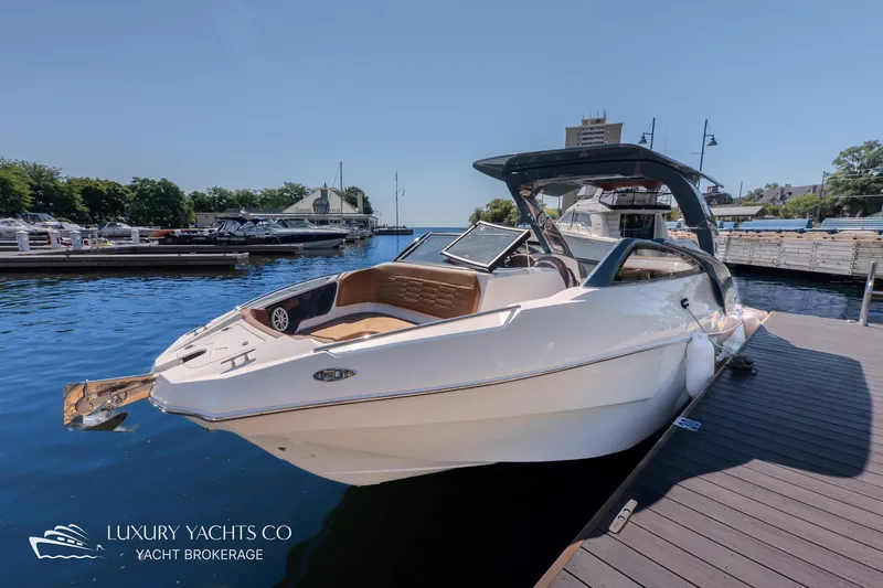  Yacht Photos Pics 2024 NX 280 Xtreme yacht docked at marina, showcasing sleek design and luxury features.