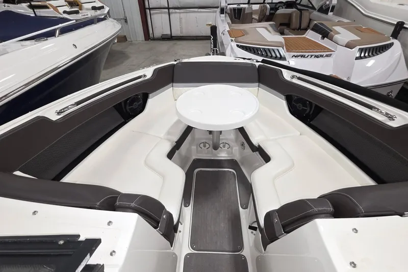  Yacht Photos Pics 2017 Sea Ray SLX 280 boat interior with seating and table in showroom.