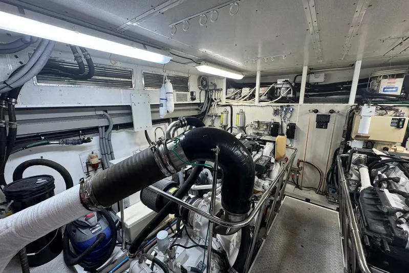  Yacht Photos Pics Engine room of a 2003 Hargrave Open Bridge yacht, showcasing machinery and equipment.
