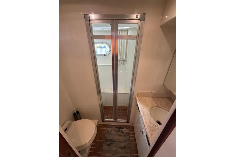  Yacht Photos Pics Bathroom interior of 2003 Hargrave Open Bridge yacht with shower and sink.