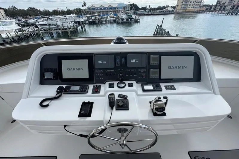  Yacht Photos Pics 2003 Hargrave Open Bridge yacht helm with Garmin navigation systems and waterfront view.