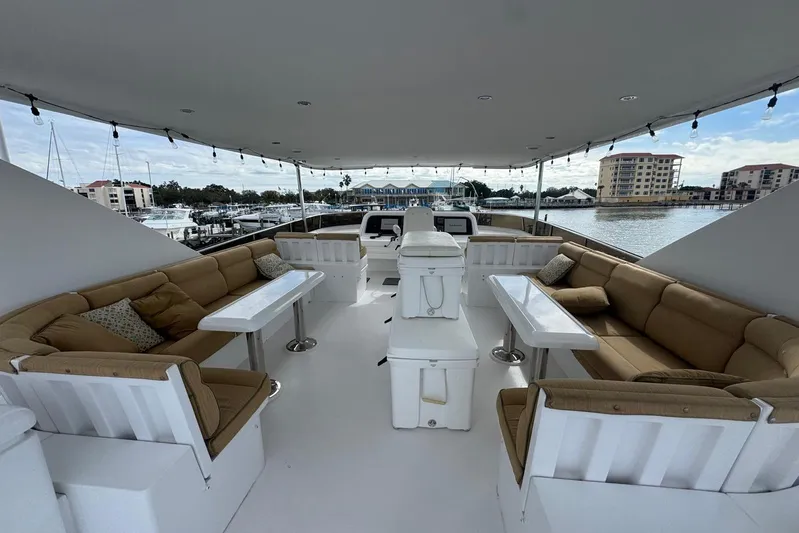  Yacht Photos Pics Luxurious 2003 Hargrave Open Bridge yacht with spacious seating and scenic marina view.