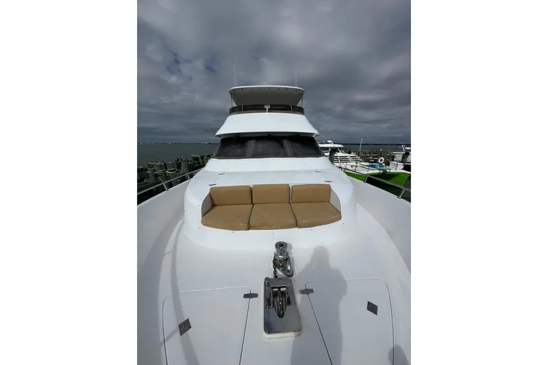  Yacht Photos Pics 2003 Hargrave Open Bridge yacht with spacious deck and seating under cloudy skies.