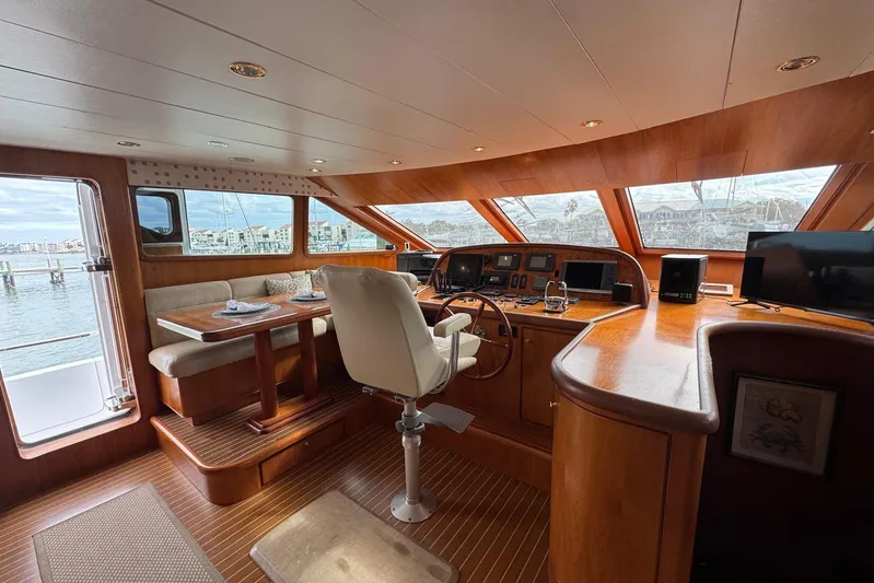  Yacht Photos Pics Luxurious 2003 Hargrave Open Bridge yacht interior with helm, dining area, and panoramic windows.