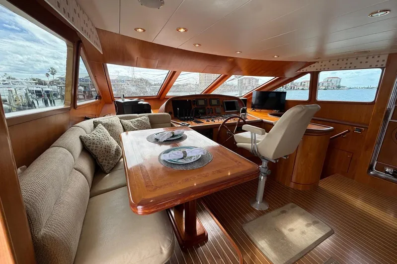  Yacht Photos Pics Luxurious interior of 2003 Hargrave Open Bridge yacht with elegant wood finishes.