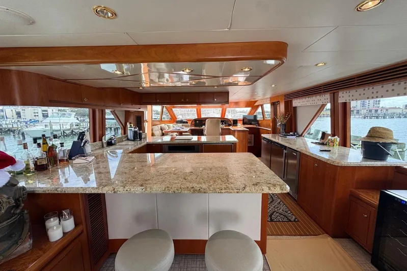  Yacht Photos Pics Luxurious 2003 Hargrave Open Bridge yacht interior with elegant wood and granite finishes.