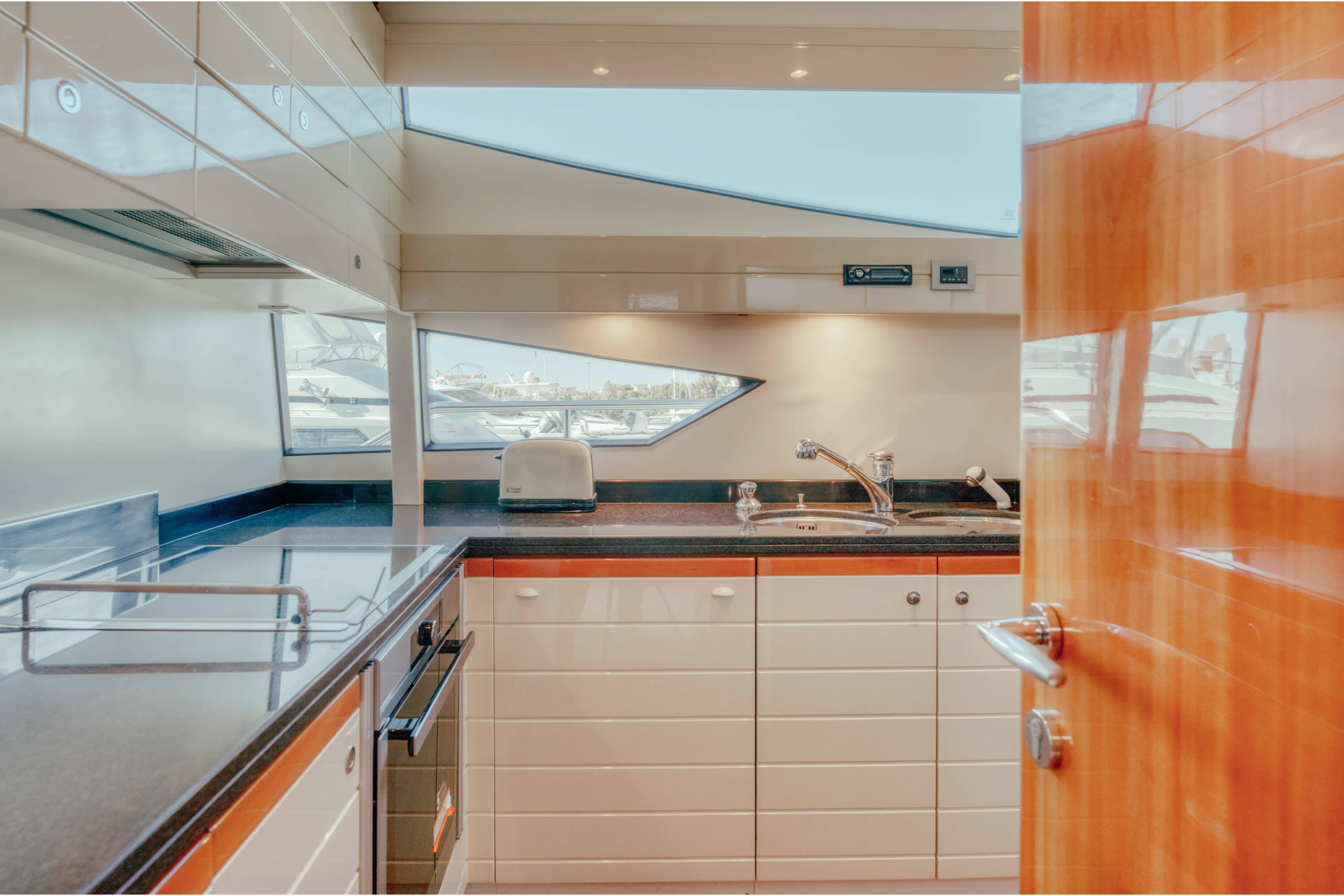  Yacht Photos Pics Luxurious kitchen interior of 2006 Ferretti Yachts 830 with modern appliances and sleek design.