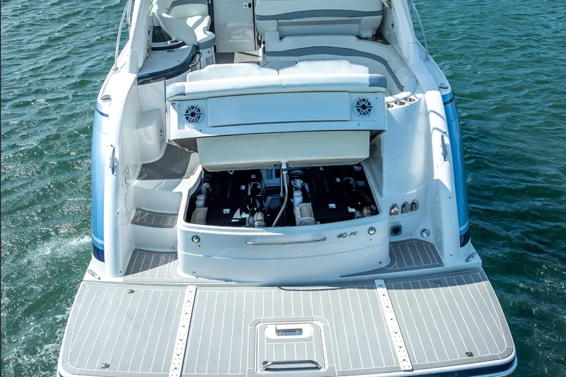  Yacht Photos Pics 2022 Formula 40 Performance Cruiser with open engine compartment on water.